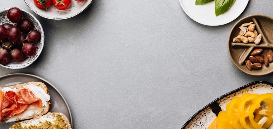 Fresh ingredients with sandwiches in a flat lay style, offering a gourmet meal concept.